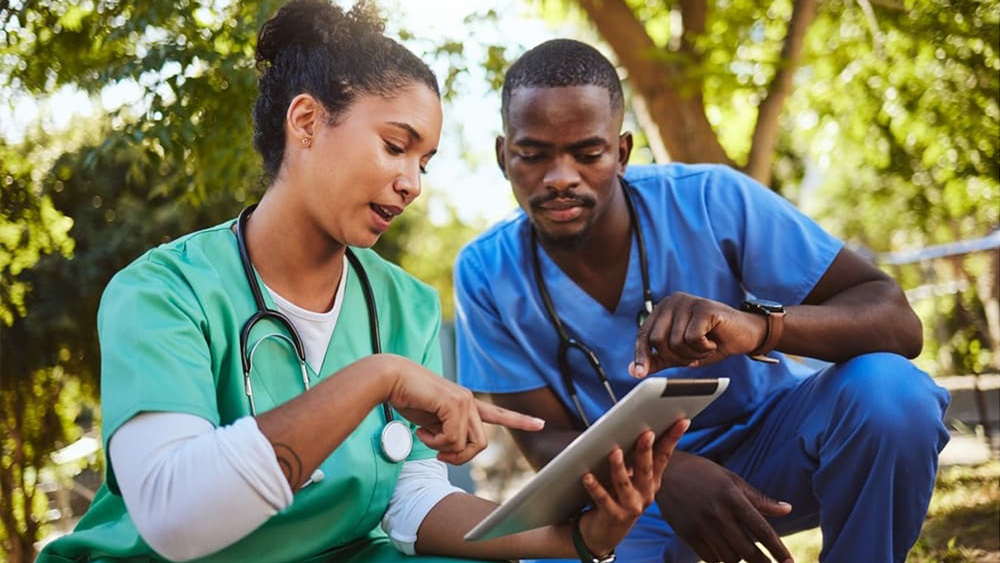 A nurse leader consults with her colleague about a patient’s care